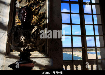 Bright sunlight casts shadows out of door and window frames in the giant Hall of Mirrors in the Chateau Versaille, Paris, France Stock Photo