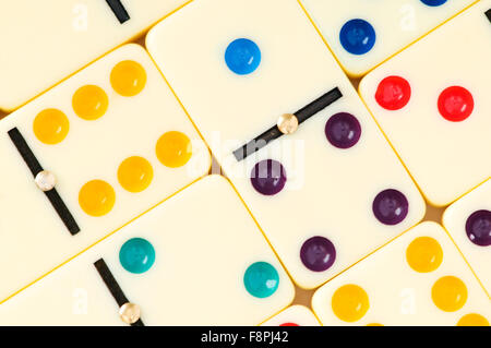 Colourful dominoes arranged at the background Stock Photo