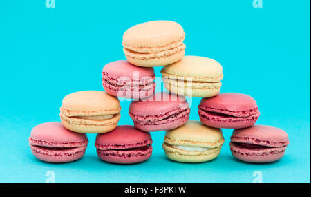 Pile of French Macaroons on retro-vintage background Stock Photo