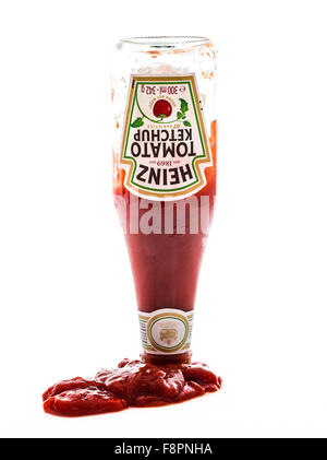 Upturned bottle of Heinz Tomato Ketchup on a white background Stock Photo