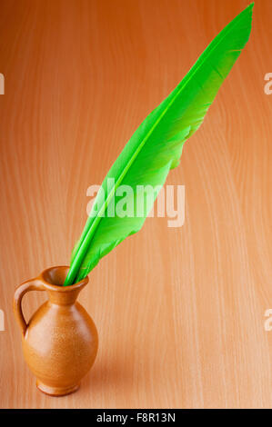 Writing feather against gradient background Stock Photo