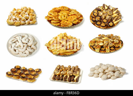 array of nine groups of different types of sweet and salty baked goods, arranged on plates, on a white background Stock Photo