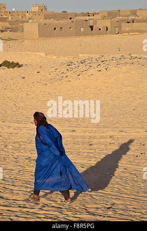 Tuareg man walking to thier camp in timbuktu Stock Photo