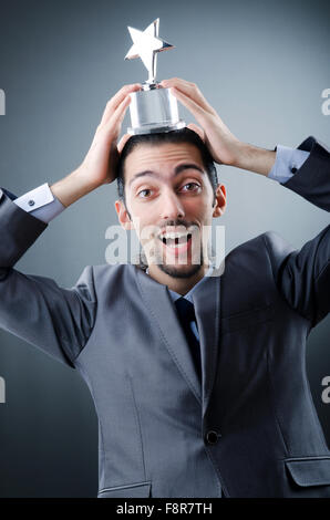 Businessman awarded with star award Stock Photo - Alamy