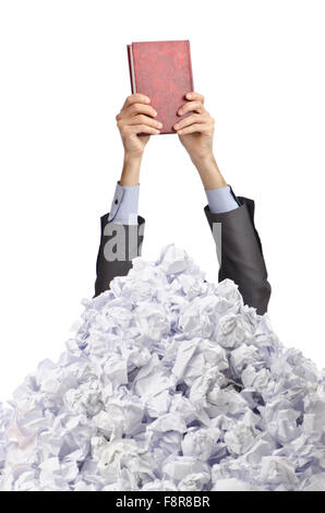 Man with lots of crumpled paper Stock Photo