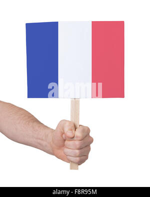 Hand holding small card, isolated on white - Flag of France Stock Photo