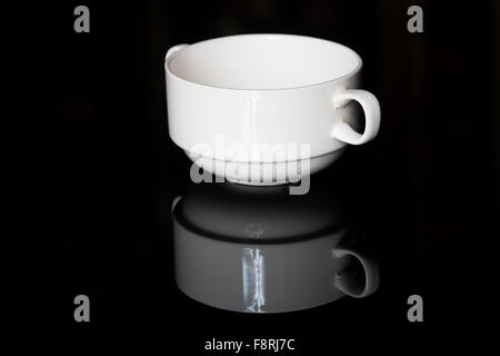 Empty white porcelain sauce-boat Stock Photo