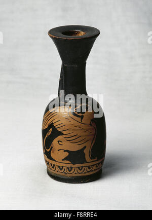 Lekythos. Type of Greek potterry used for storing olive oil. 4th century BC. Red- figure vase painting. Decorated with winged sphinx and geometric frieze. Height 110 mm. 45 mm diameter. From Campania, Magna Graecia, Italy. Perfume Museum. Barcelona. Spain. Stock Photo