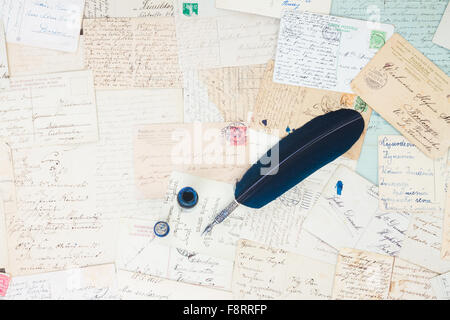 feather pen and antique letters Stock Photo