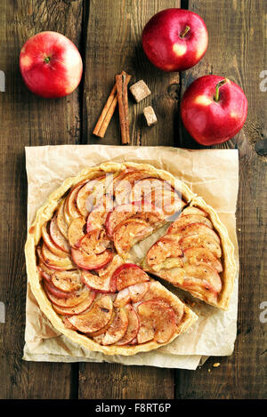 Pie with red apples on wooden table, top view Stock Photo