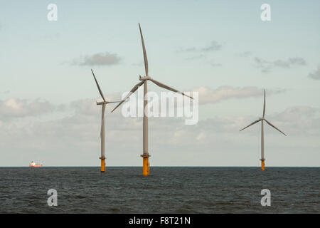 A view of the wind turbines off the coast of Redcar,England,UK with a ship in the distant background Stock Photo