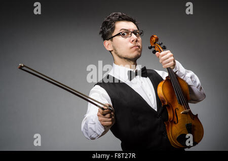 Funny violin player with fiddle Stock Photo