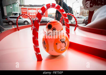A Star Wars droid toy in the Target 'Wonderland!' pop-up store in the Meatpacking District in New York on its grand opening day, Wednesday, December 9, 2015. According to Target the store combines physical and digital shopping using medallions given to visitors with an embedded RFID chip. Tapping the chip to an antenna near the product lets you order it. The store is an experiment in technology replacing shopping carts with chips.  (© Richard B. Levine) Stock Photo