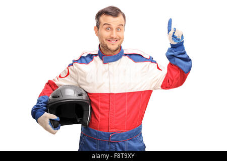 Young male car racer holding a helmet and having an idea isolated on white background Stock Photo