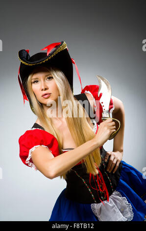 Woman pirate with sharp weapon Stock Photo
