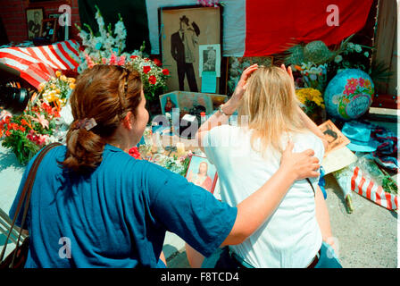 Visitors pay their respects to Frank Sinatra who passed a way on May 14, 1998 after suffering a heart attack.  Residents constructed a shrine on the site in Hoboken where the house that Sinatra grew up in once stood.  December 12, 2015 would be Sinatra's 100th birthday. Stock Photo