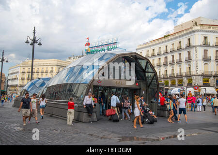 Cercanias station entrance and Tio Pepe neon sign on its new location. Puerta del Sol, Madrid, Spain. Stock Photo