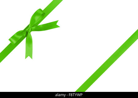 green ribbon with bow for packaging with tails isolated on white Stock Photo