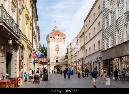 St. Florian's Gate and street scene with people and shops in Ulica Florianska Street, Krakow, Poland Stock Photo