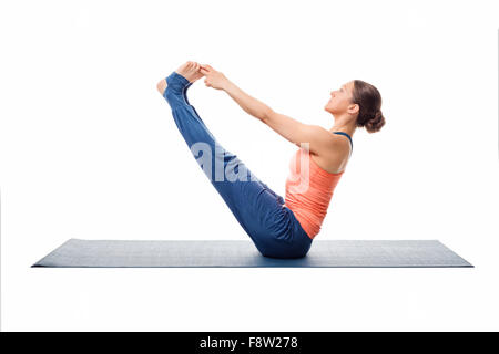 Beautiful sporty fit woman practices yoga asana Stock Photo