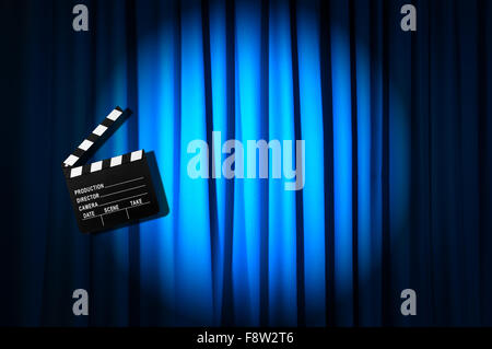 Movie clapper board against curtain Stock Photo