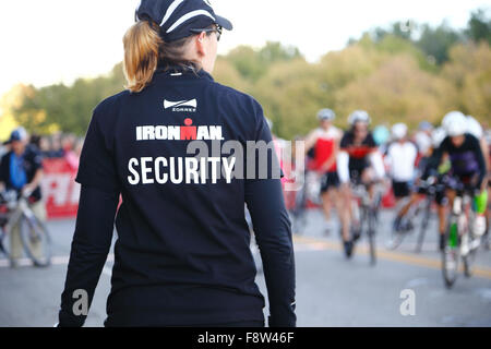 Female volunteer working security at the Louisville Ironman Triathlon. Stock Photo