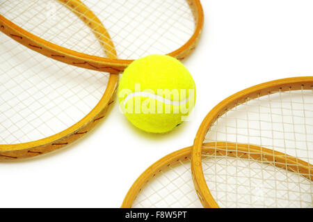 Four tennis rackets and balls isolated on white Stock Photo