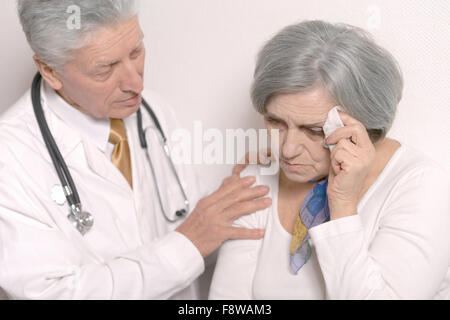 Doctors discussing at table Stock Photo