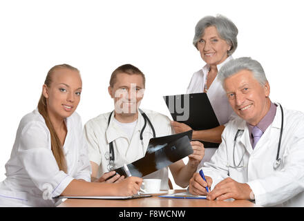 Doctors discussing at table Stock Photo