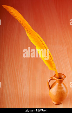 Writing feather against gradient background Stock Photo