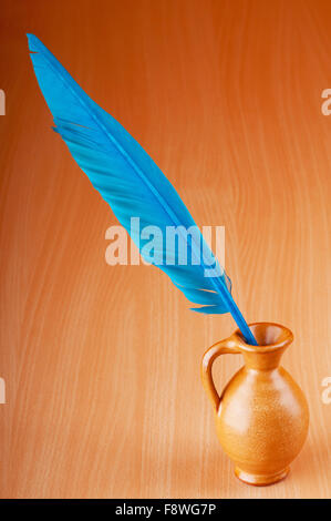 Writing feather against gradient background Stock Photo