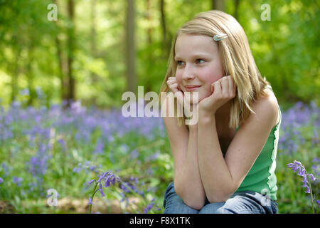 Child and bluebells Stock Photo
