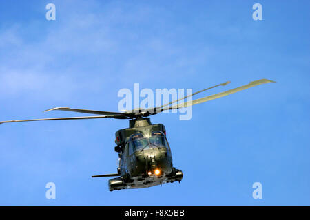 Military helicopter in flight at UK air show Stock Photo
