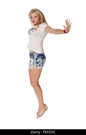 Cheerful dancing girl jumping short on white background flying hair Stock Photo