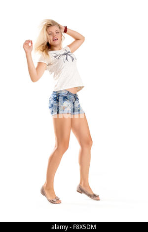 Cheerful dancing girl jumping short on white background flying hair Stock Photo