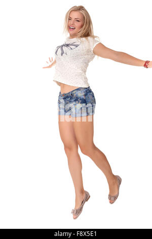 Cheerful dancing girl jumping short on white background flying hair Stock Photo