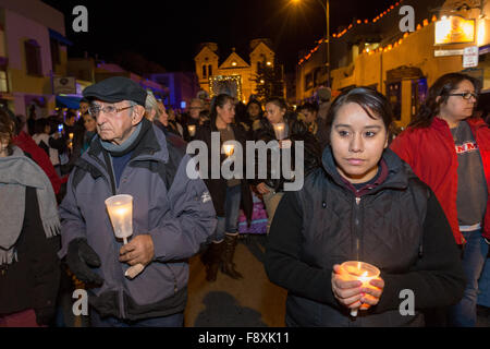 Santa Fe, New Mexico, USA. 11th December, 2015. Catholic faithful during a candle light procession from the Cathedral Basilica of St. Francis of Assisi celebrating our Lady of Guadalupe December 11, 2015 in Santa Fe, New Mexico. Guadalupanos as the devotees are known, celebrate the apparitions of the Virgin Mary to an Aztec peasant at Tepeyac, Mexico in 1531. Stock Photo