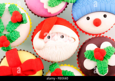 Christmas small cupcakes Santa in middle and snowman Stock Photo