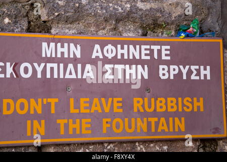 No rubbish sign, with rubbish on. Mithymna or Molyvos, Lesvos, Greece Stock Photo