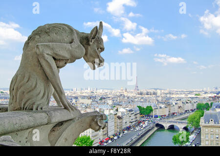 Gargoyle Statue in Notre Dame Cathedral and Paris aerial cityscape with Eiffel Tower on background. Paris, France Stock Photo