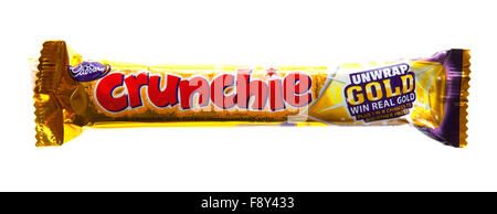 Cadbury's Crunchie Chocolate bar on a white background Stock Photo