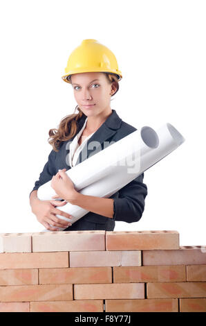Businesswoman with drawings near brick wall Stock Photo