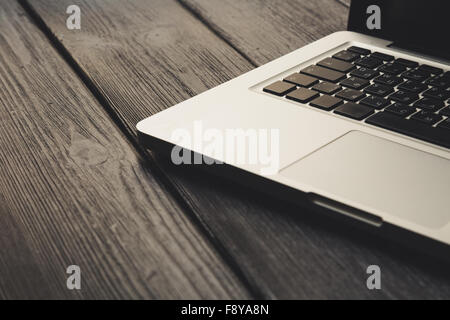 Laptop on modern wooden desk Stock Photo