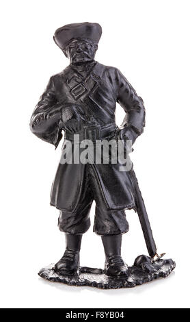Old pirate captain in authentic looking costume close-up isolated on a white background. Miniature figurine of a children's toy. Stock Photo