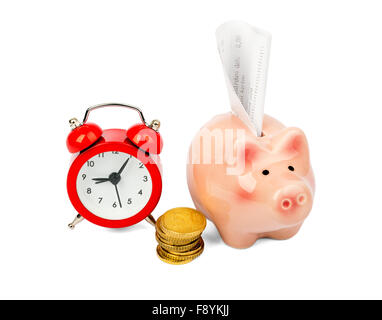 Piggy bank with coins and alarm clock Stock Photo