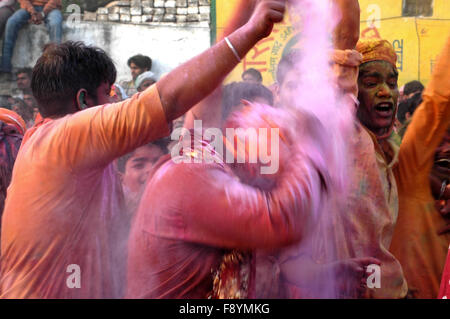 Large number of people gathered sprinkle colored water and powder at Radha Rani Temple at Barsana, Mathura, Uttar Pradesh India. Stock Photo