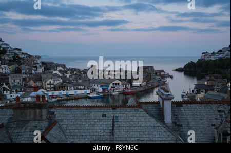 Looking across the rooftops to the fishing port of East Looe in Cornwall Stock Photo