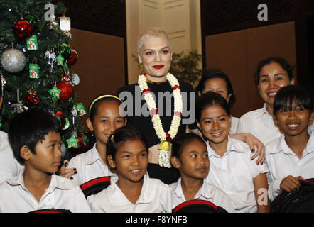 Phnom Penh, Cambodia. 12th Dec, 2015. British pop singer Jessie J (C) poses for photos with Cambodian school children in Phnom Penh, Cambodia, Dec. 12, 2015. Jessie J performed at a concert here Saturday night, attracting a huge crowd of fans. Credit:  Sovannara/Xinhua/Alamy Live News Stock Photo