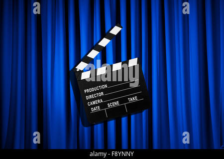 Movie clapper board against curtain Stock Photo