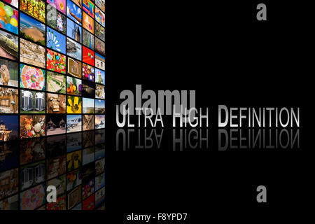 Concept of Ultra High Definition TV on black background with reflection Stock Photo